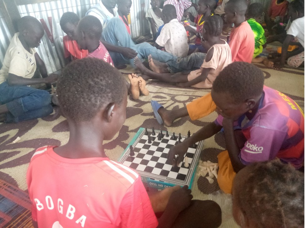 Children play chess at WOCO’s CFS at sector two in Malakal PoCs.